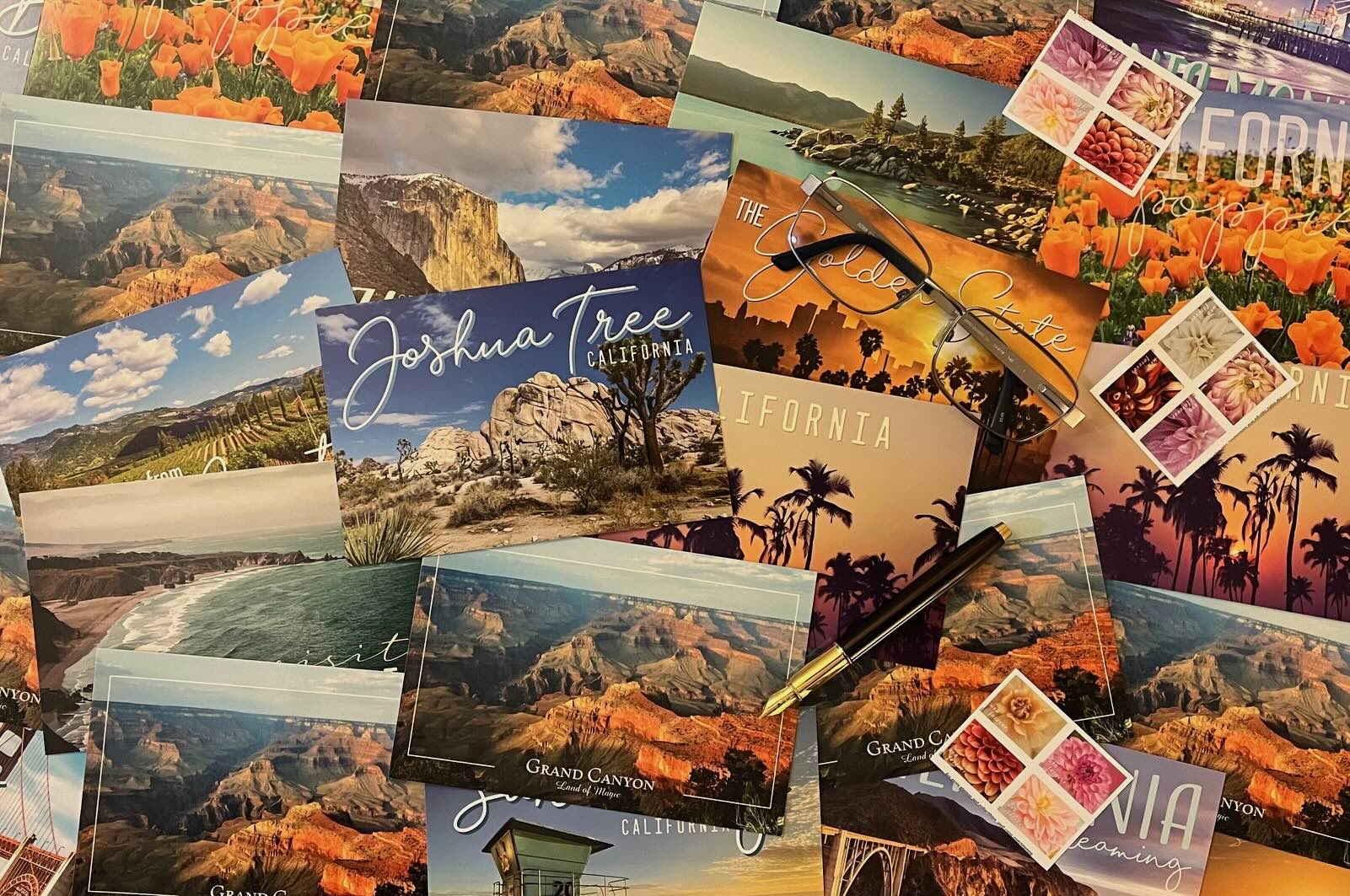 Handwritten postcards on a wooden desk